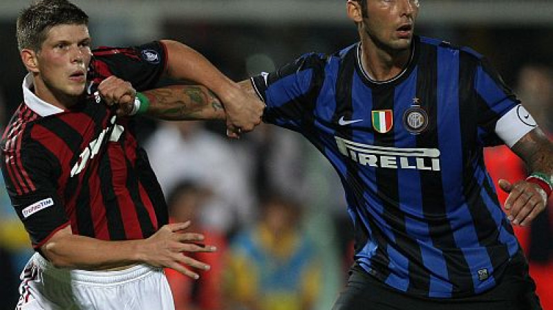 Klāss Jans Huntelārs cīņā ar Marko Materaci 
Foto: Digitale