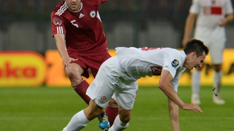 Oļegs Laizāns cīņā ar poli Rafalu Voļski
Foto: AP/Scanpix