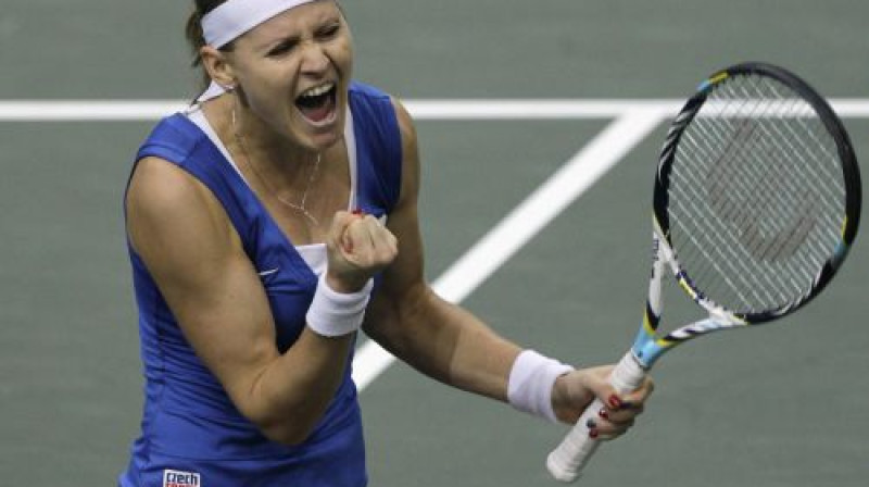 Lucija Šafaržova pēc uzvaras pret Anu Ivanoviču
Foto: Reuters/Scanpix