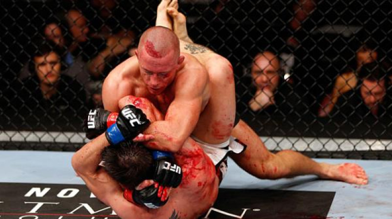 Džordžs Santpjērs cīņā ar Karlosu Konditu
Foto: sherdog.com