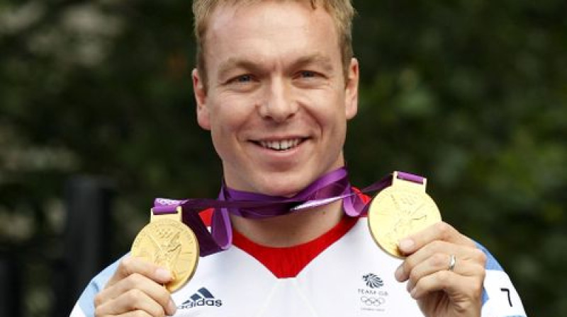 Kriss Hojs ar Londonas olimpiskajās spēlēs izcīnītajām zelta medaļām
Foto: AFP/Scanpix