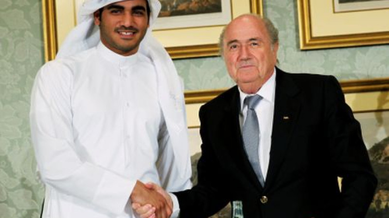 PK 2022 komitejas Hamads Al-Thani un FIFA prezidents Zeps Blaters 
Foto:AP/Scanpix