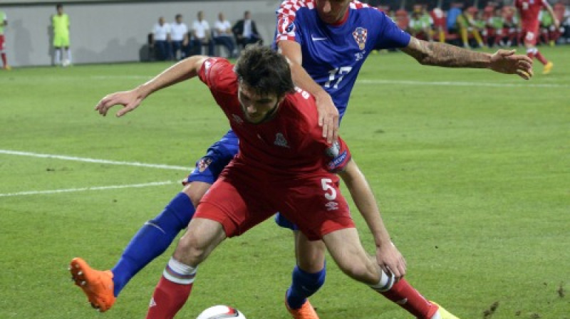 Mario Mandžukičs pret Badavi Huseinovu
Foto: AFP/Scanpix