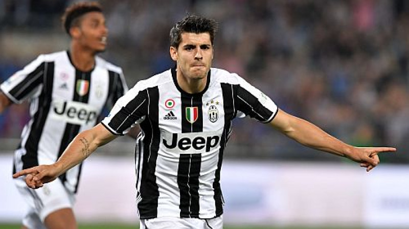 Alvaro Morata atzīmē savu uzvaras nesošo vārtu guvumu
Foto: AFP/Scanpix