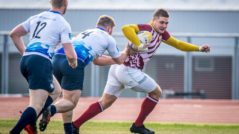 Elmārs Šefanovskis (pa labi) spēlē pret Somiju. Foto: Zigismunds Zālmanis (LRF)