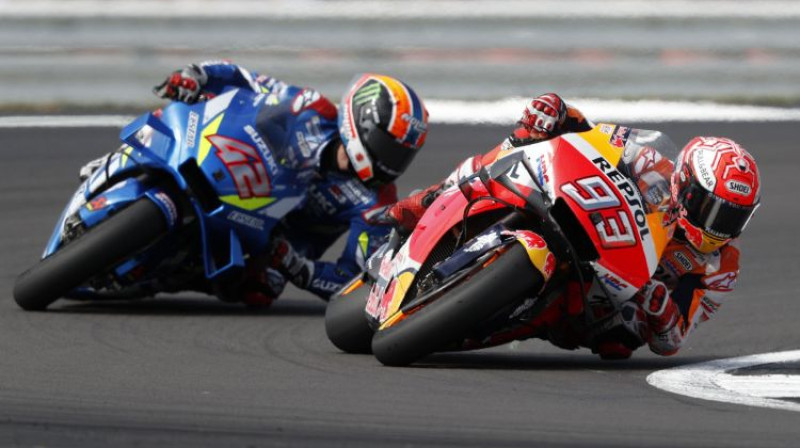 Alekss Rins un Marks Markess. Foto: AFP/Scanpix