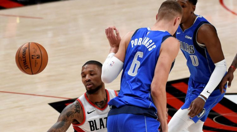 Kristaps Porziņģis un Deimiens Lilards. Foto: AP/Scanpix