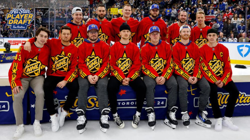 Kvina Hjūza komanda. Foto: NHL