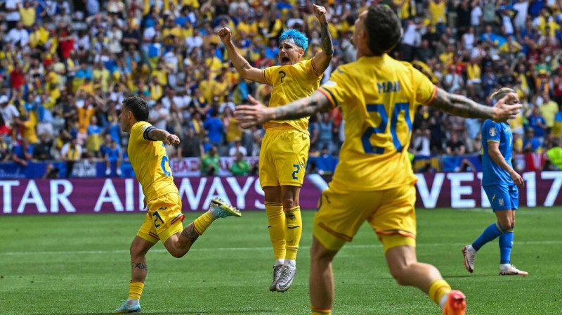 Rumānijas valstsvienības futbolistu prieki. Foto: Miguel Medina/AFP/Scanpix