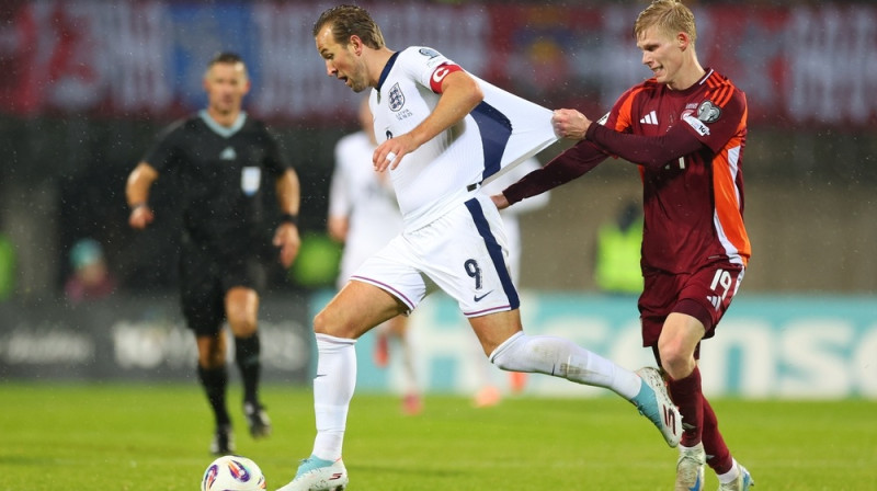 Harijs Keins pret Maksimu Toņiševu. Foto: AP/Scanpix