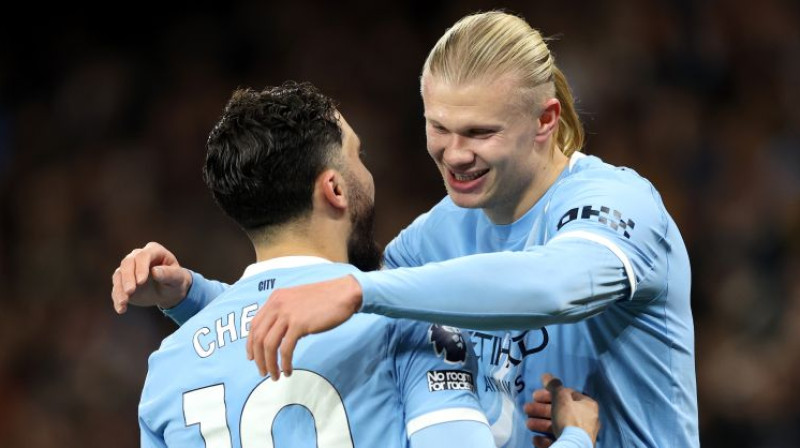 Rajans Šerkī un Ērlings Holanns. Foto: EPA/Scanpix