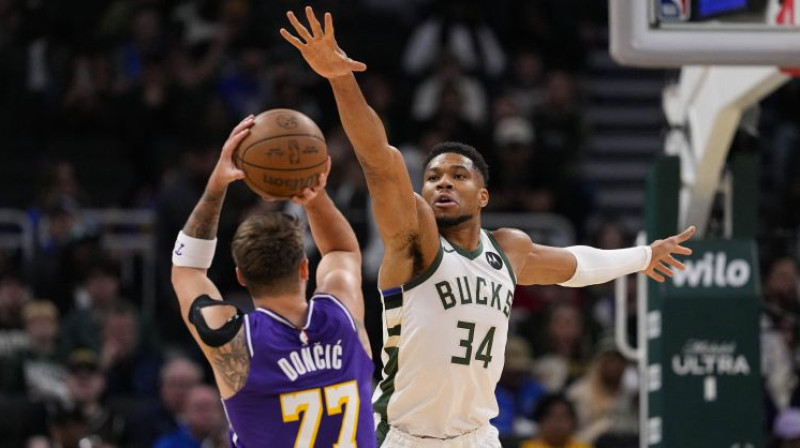 Luka Dončičs pret Janni Adetokunbo. Foto: Imagn Images/Scanpix