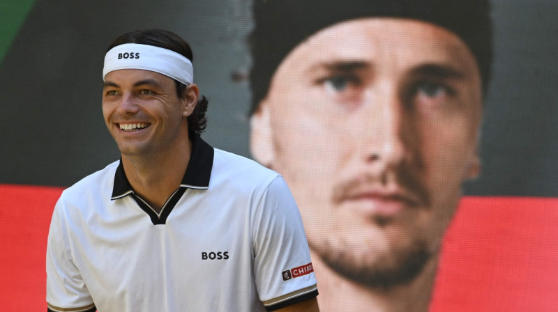 Teilors Frics un Aleksandrs Zverevs. Foto: AFP/Scanpix